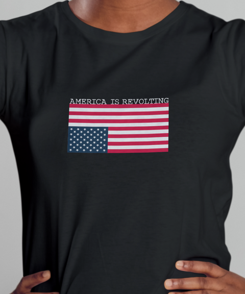 Black t-shirt with an upside down American flag and 'America is Revolting' graphic above the flag.